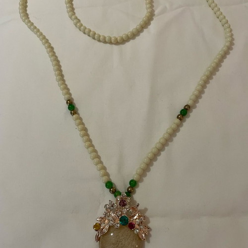 Vintage necklace used with cream and green semiprecious beads and cabochon pendant