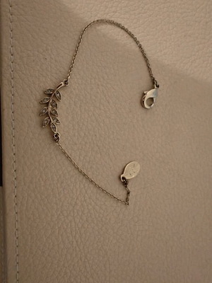 Gold bracelet with leaf element and rhinestones like new