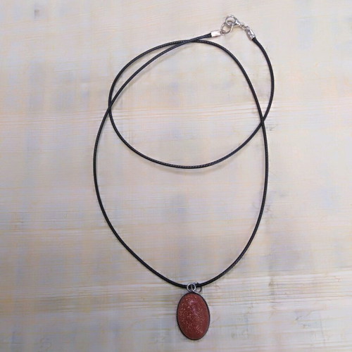 Handmade pendant with goldstone and steel cabochon new, brown