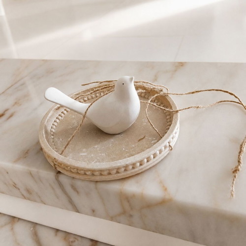 Decorative hanging bird on round tray like new