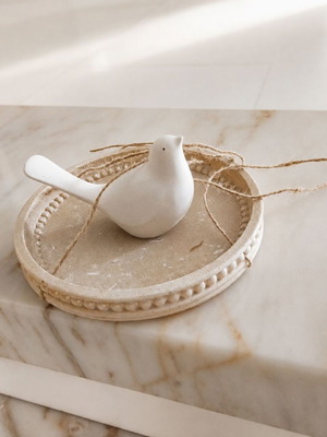 Decorative hanging bird on round tray like new