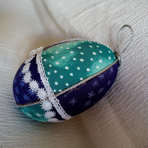 Decorative egg used blue light blue with stars and lace