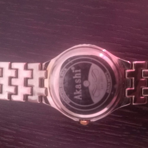 Akashi men's and women's watch set like new, gold and silver