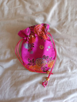 Small fuchsia pouch bag like new with embroidered details