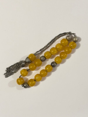 Worry beads with amber style beads used and metal details