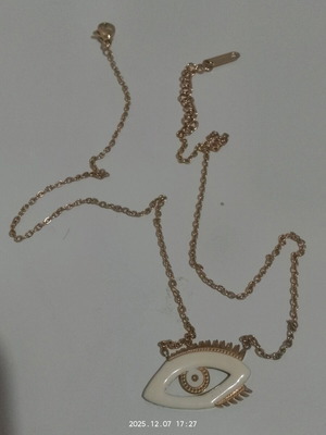 Thin gold-colored necklace used