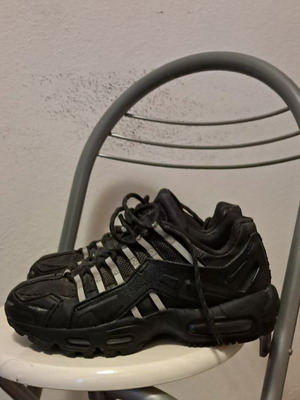 Nike Air athletic shoes like new, black with silver glow details, size 37