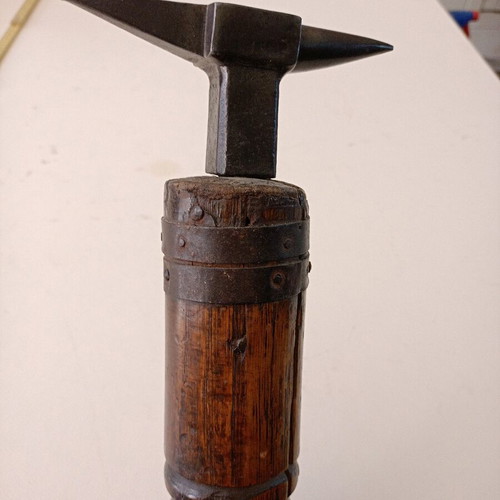 Anvil used for goldsmith or watchmaker with wooden base