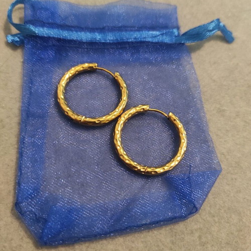 Steel earrings in gold color like new