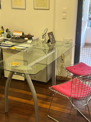 Neoset corner desk with glass top and metal legs