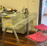 Neoset corner desk with glass top and metal legs