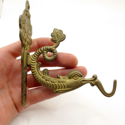 Vintage brass wall hook with mythical sea creature, like new