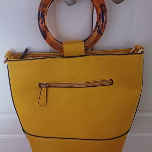 Handbag used with yellow tortoiseshell handle