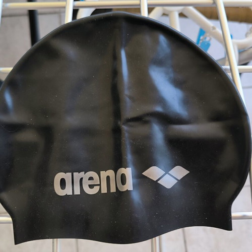 Three branded swimming caps