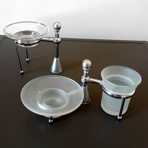 Two sets of inox bathroom accessories with glass and frosted parts