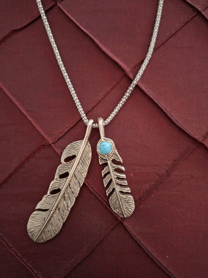 Long silver necklace with blue bead used