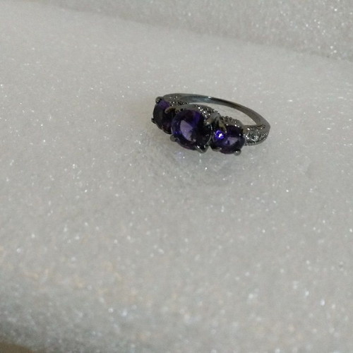 Ring with Purple Crystals and Black Plated Finish like new