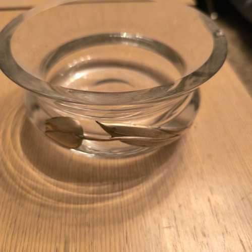 Glass decorative bowl used with silver flower design