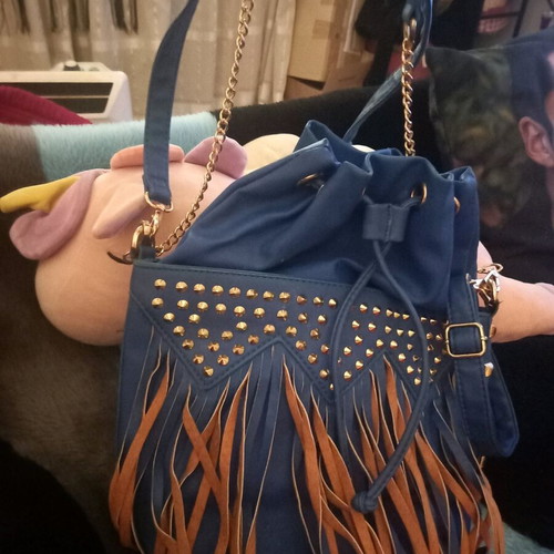 Pouch bag used with fringes, chain and shoulder strap