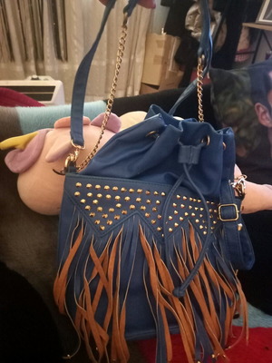 Pouch bag used with fringes, chain and shoulder strap