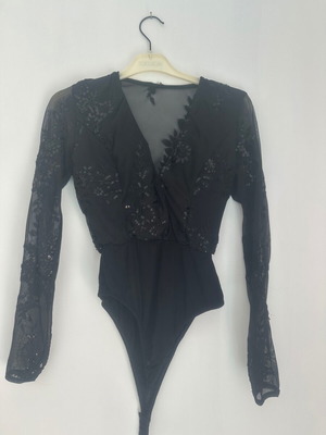 Black bodysuit with transparency and sequins size M like new