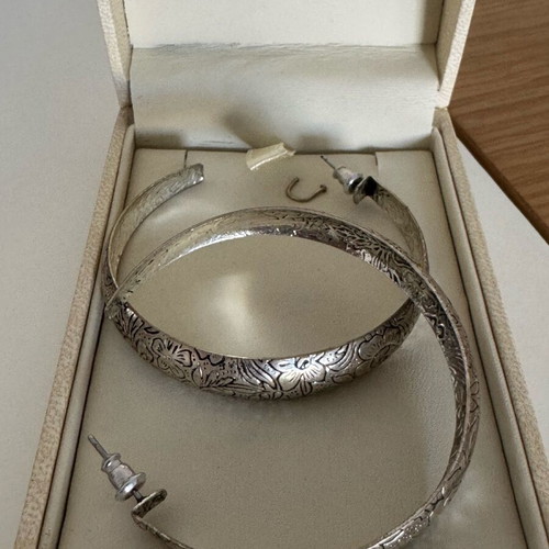 Silver hoop earrings with embossed floral design vintage chic