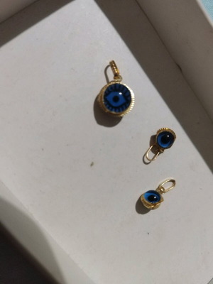 three Hanging from gold EYES