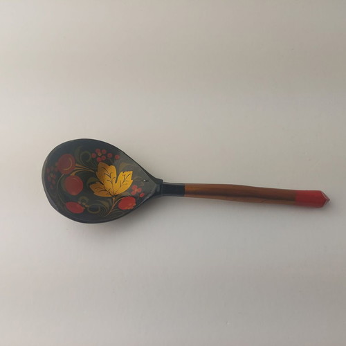 Old painted wooden spoon used