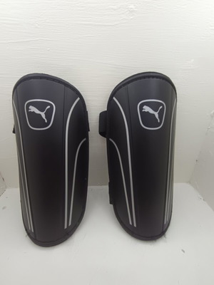Puma shin guards new with scratches