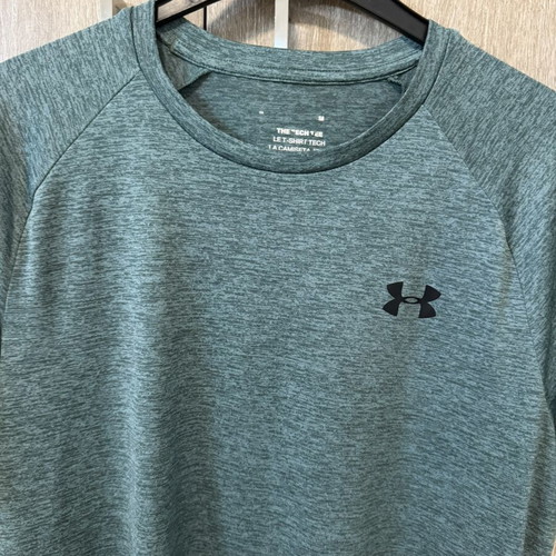 Under Armour sports shirts used, sizes Small and Medium, black and turquoise