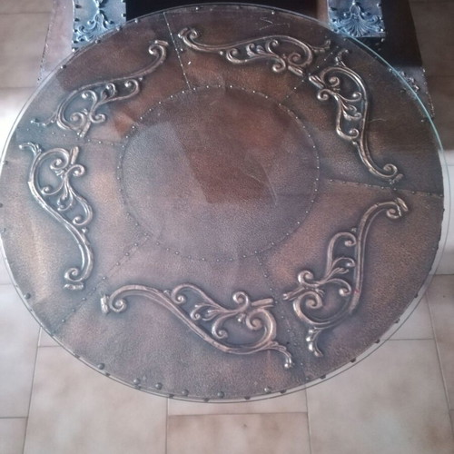 Decorative fireplace set with table and copper wall plaque