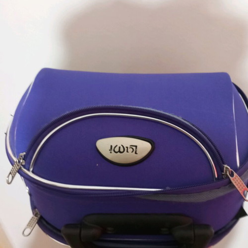 Small travel suitcase purple like new with many compartments