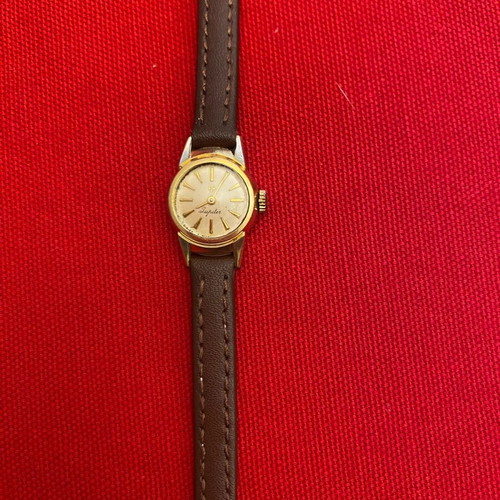 Wristwatch women's used, wind-up, metal, gold color, 1960s era