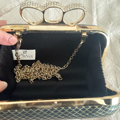 Evening bag like new with unique clasp and black-gold rhinestones