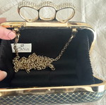 Evening bag like new with unique clasp and black-gold rhinestones