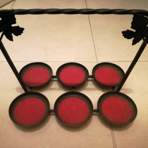 Metal candle holder for six tealights used