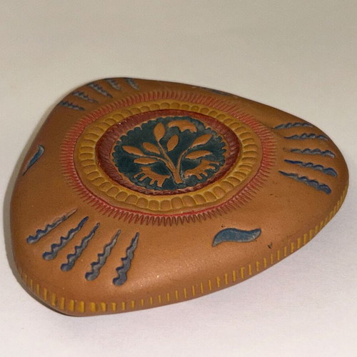 Vintage decorative clay paperweight with ethnic embossed designs, like new