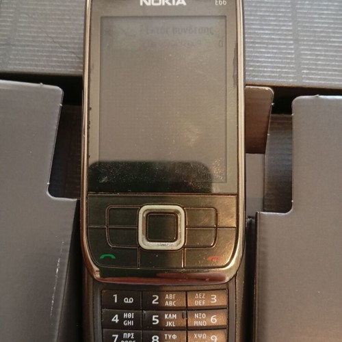 Nokia E66 retro slider phone used with original accessories