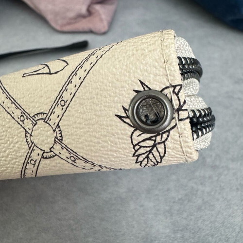 Beige wallet with designs like new