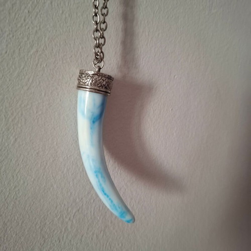 Long necklace used with elephant tooth design in white and turquoise