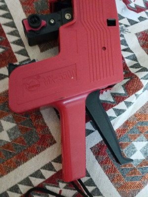 Motex MX-5500 handheld price labeler used with minor damage