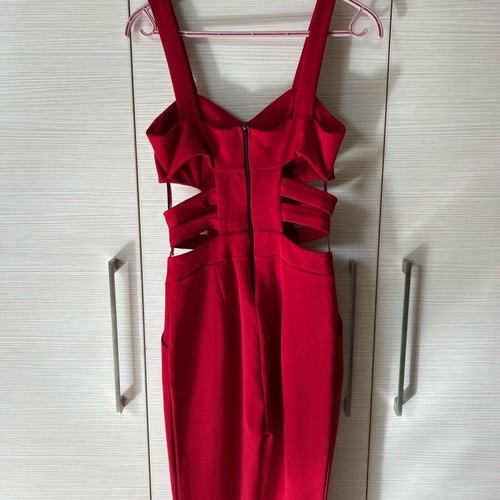 Red one-piece jumpsuit like new with side cutouts and bust support