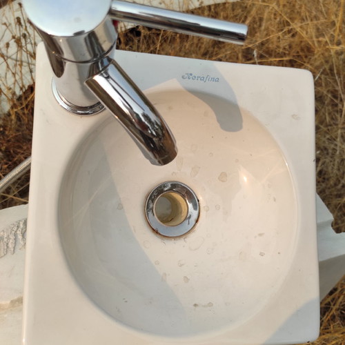 Sink with faucet and valve used