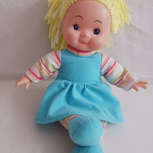 Doll with blonde yarn hair like new, soft body