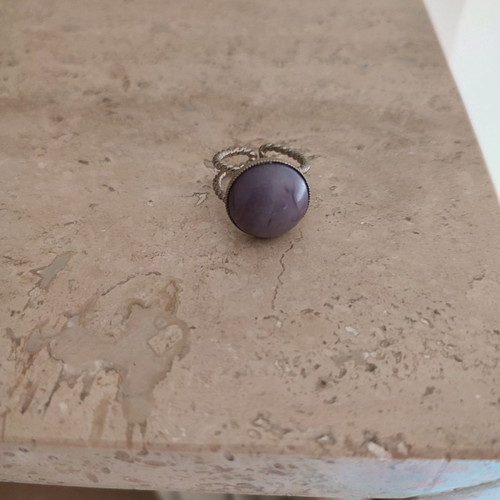 Faux ring with purple stone used, adjustable size