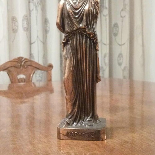 Caryatid metal statue like new