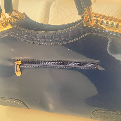 Navy Blue Lustre Handbag like new with gold metal details