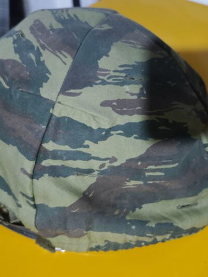 Military helmet M1 type used with camouflage cover and liner