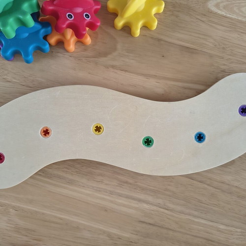 Baby toy with gears like new, wooden base and plastic gears