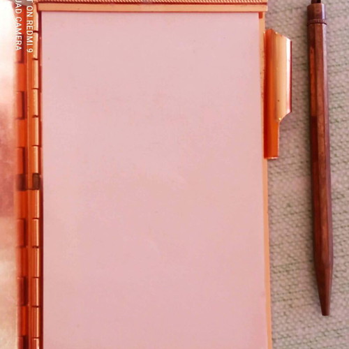 Vintage metal pocket notebook with integrated pencil used 1940-1950